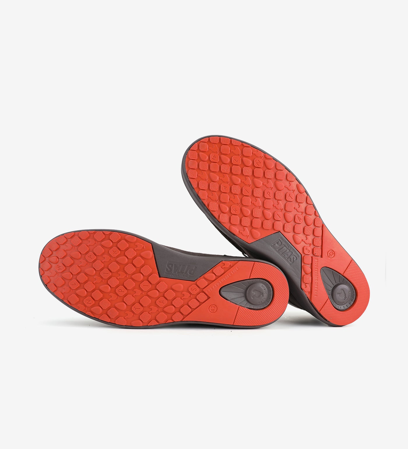 Red hi-grip soles of Baikal Boots by Pitas, showcasing durable and slip-resistant design for reliable wear.