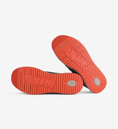 Bottom view of Bali Boots by Pitas showcasing grippy red rubber outsoles with brand logo, designed for all-season comfort.