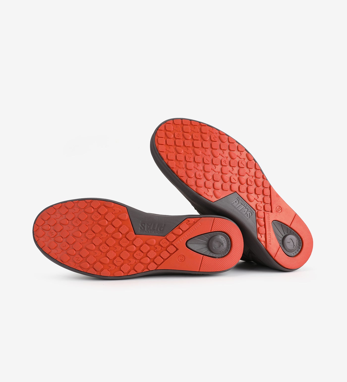 Red hi-grip soles of Jaya Chukka Boots by Pitas, featuring Pitas-Tex waterproof technology for comfort and durability.