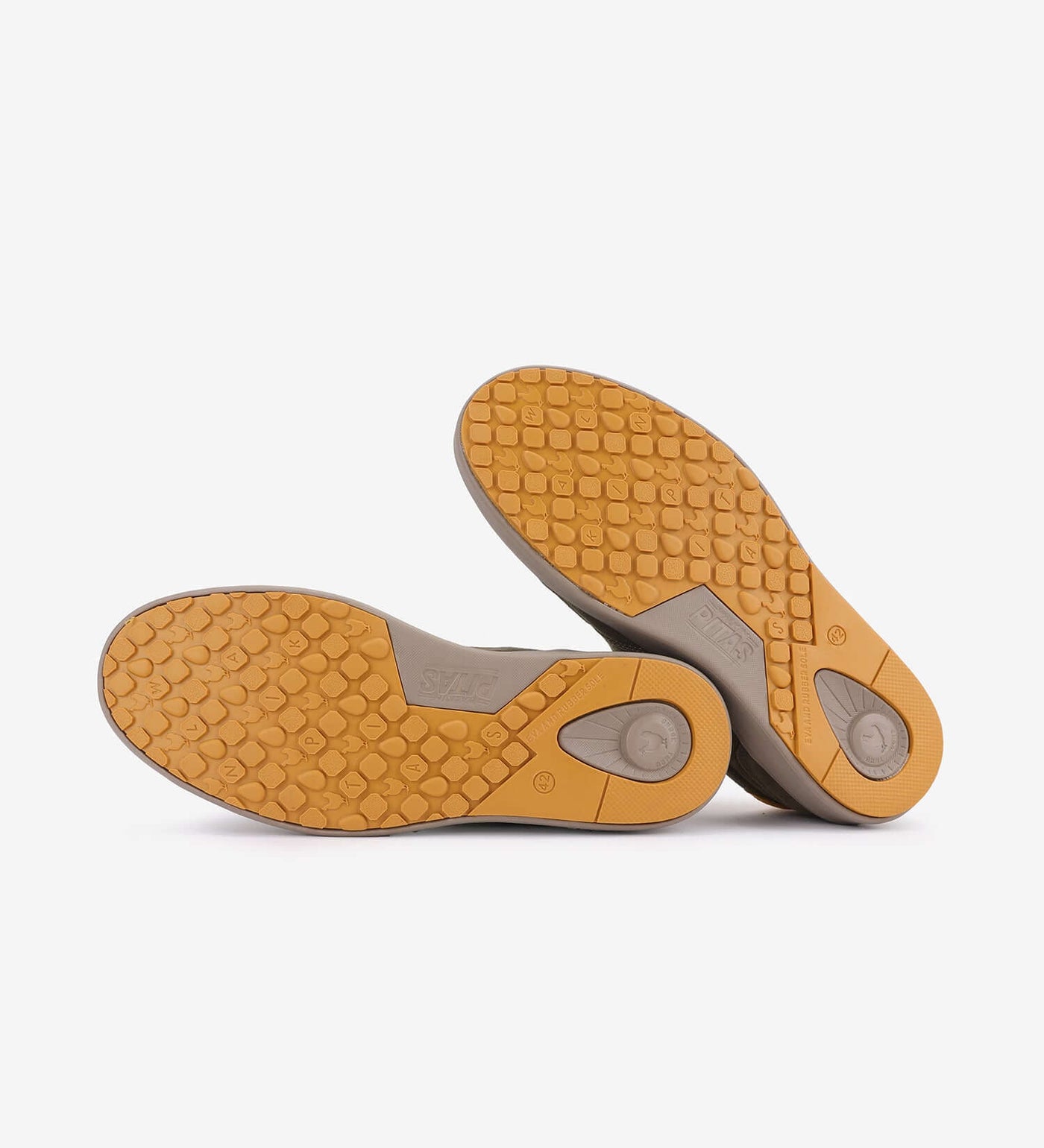 Bottom view of Kume Sneakers by Pitas showing non-slip soles in a honeycomb pattern for traction and durability.