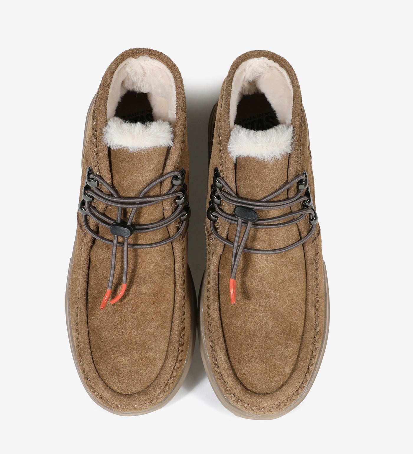 Water-resistant Ontario Mocs by Pitas with faux-fur lining, suede moccasin design, and elastic laces for winter comfort.