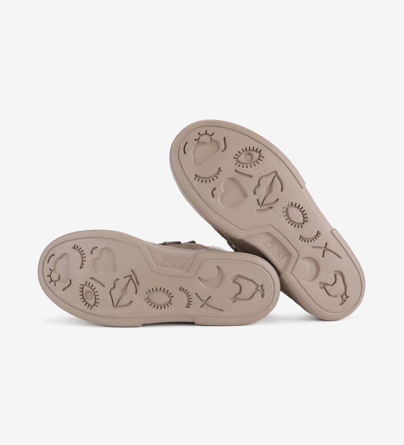 Unique patterned soles of Vanda Mocs by Pitas, showcasing detailed traction design for enhanced grip and style.